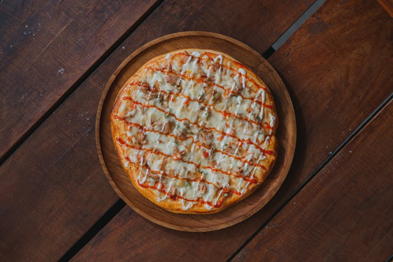 Buffalo Chicken pizza with crispy chicken and blue cheese